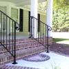 Modified Birmingham Style Handrail with round collars and scrolled volutes.  Also seen here with cover shoes at the base of the posts, which hides the mounting hardware and creates a more finished look.